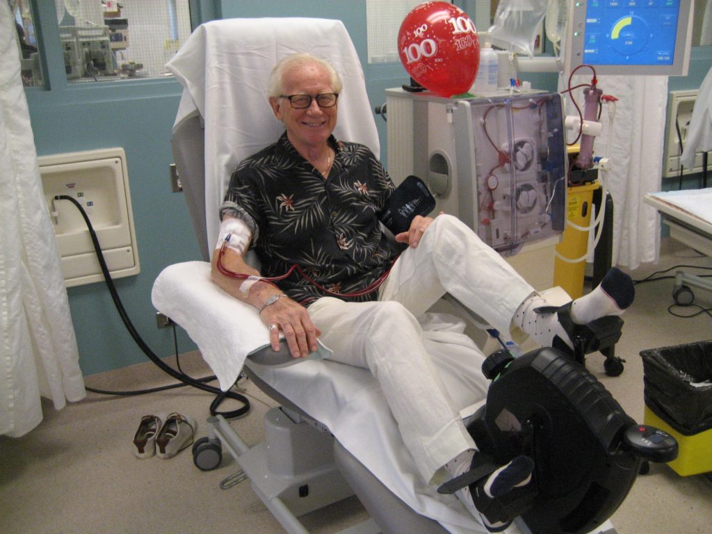 An elderly man on a hospital bed